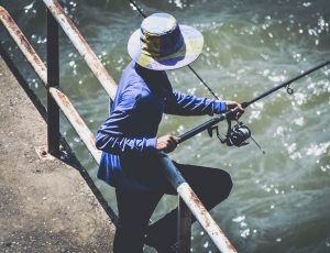 person holding fishing rod thumbnail